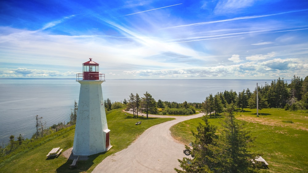 lighthouse beside pathway during daytime