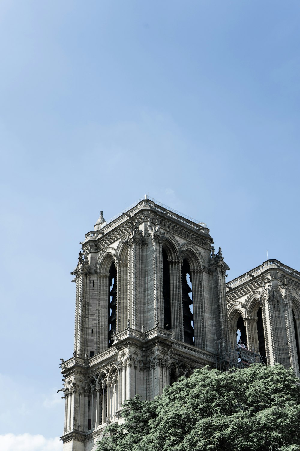 a very tall building with a clock on it's side