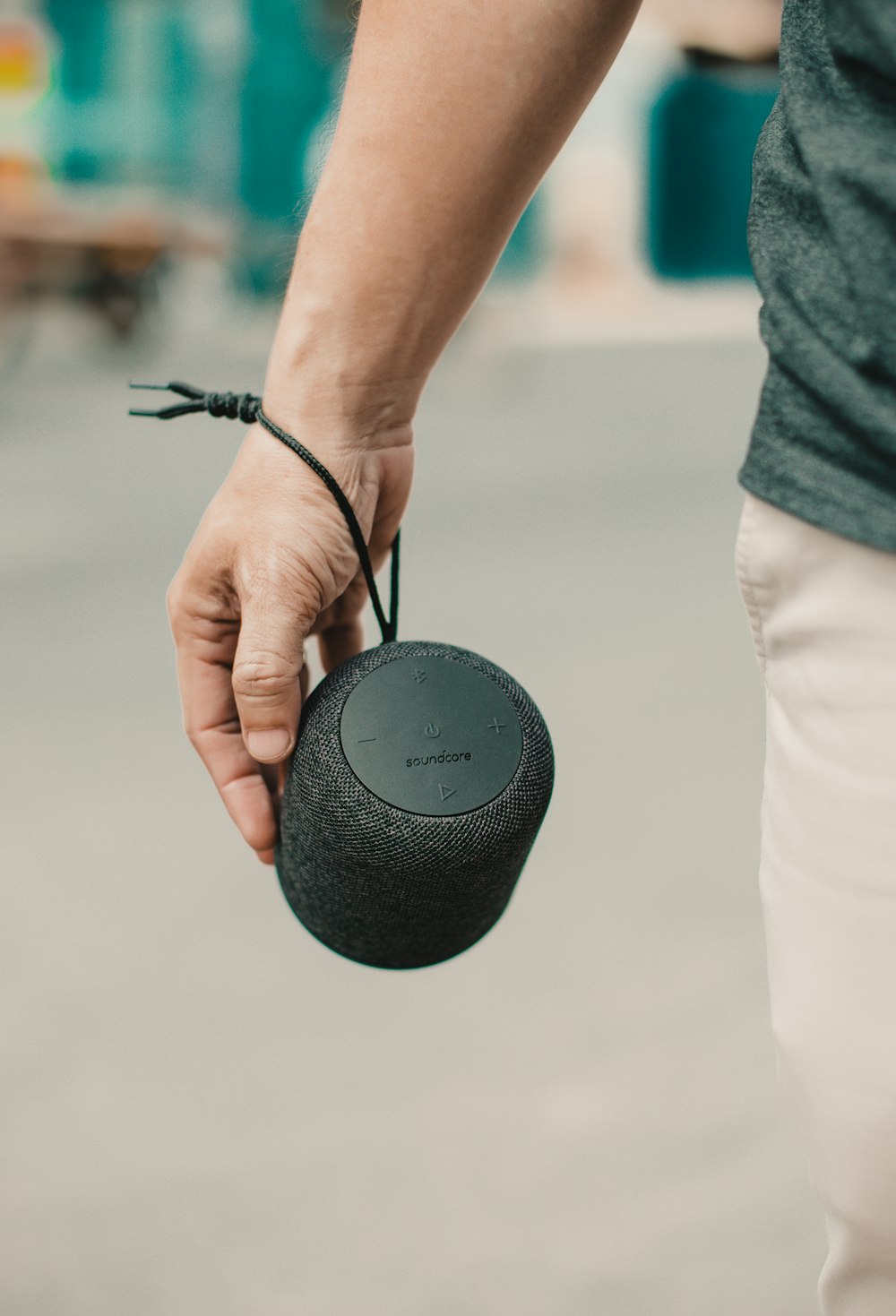 person carrying portable speaker