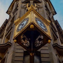 brown hanging street clock