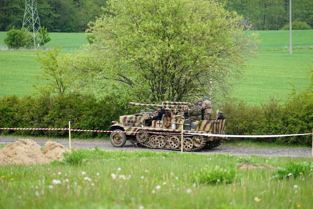 tank beside tree