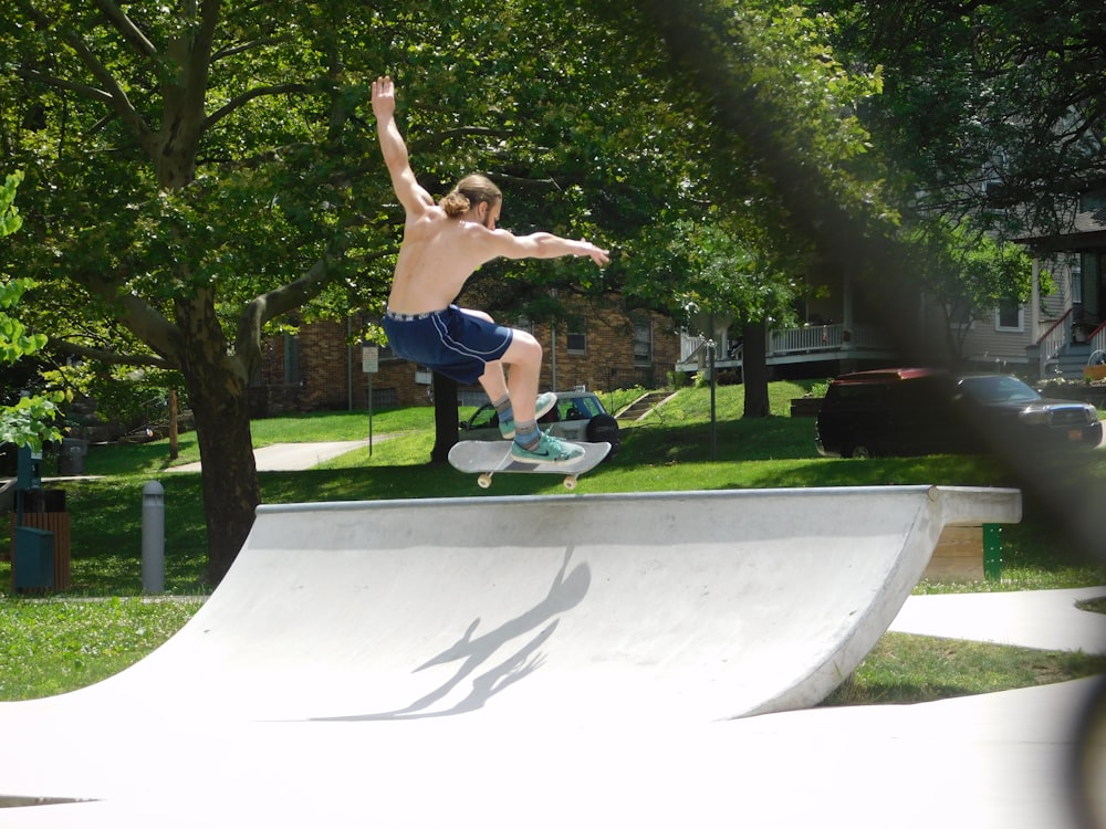 topless man skateboarding