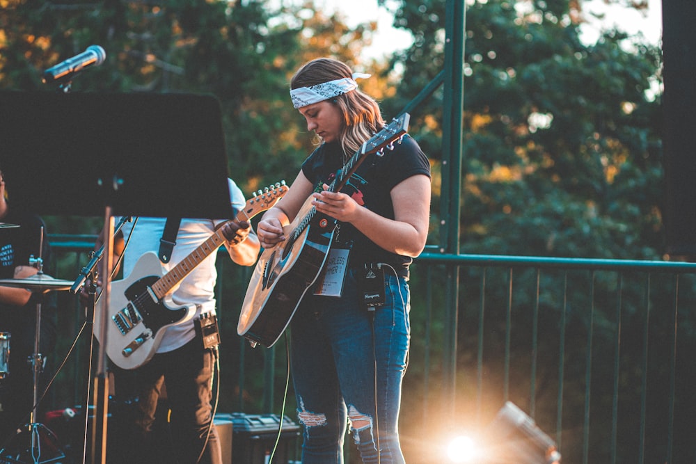 woman playing guitar