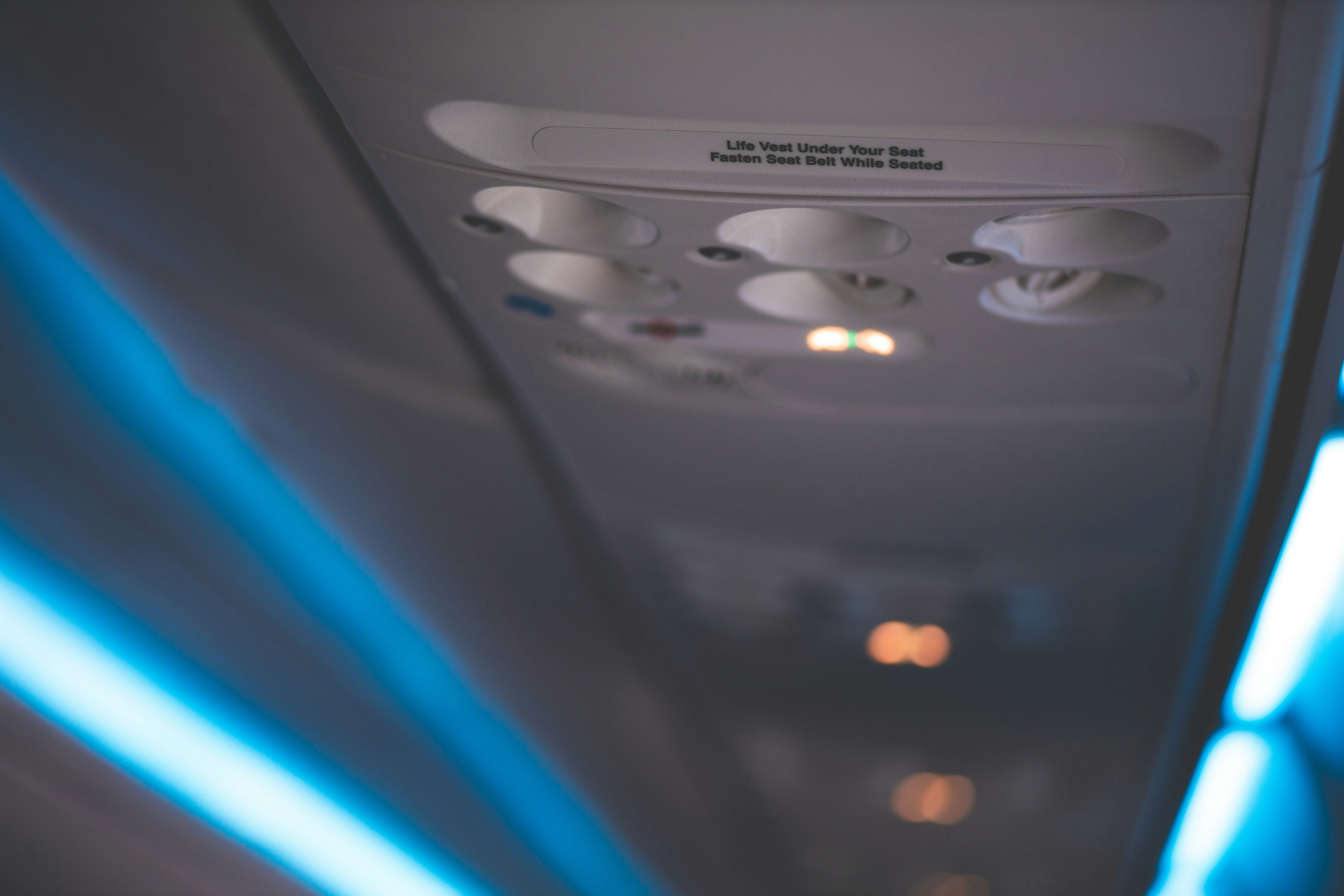 the inside of an airplane with blue lights, 