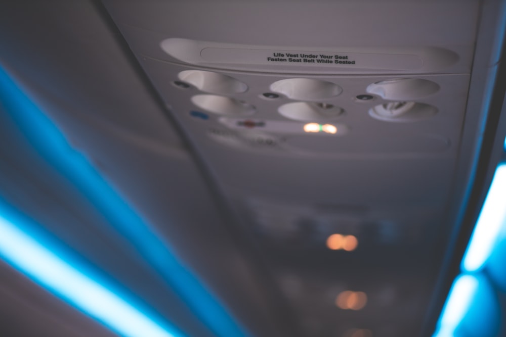 the inside of an airplane with blue lights