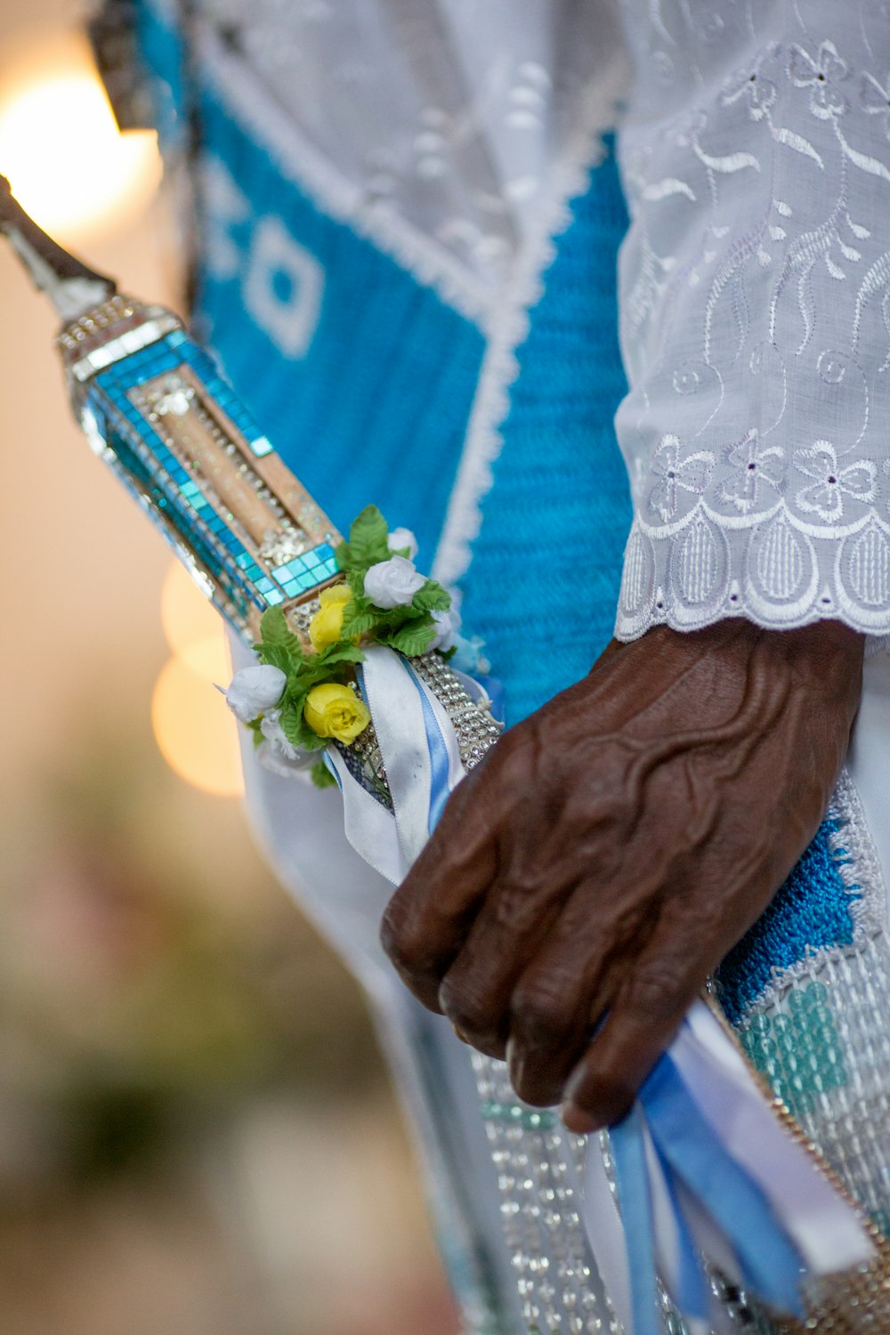 person holding blue and brown handle