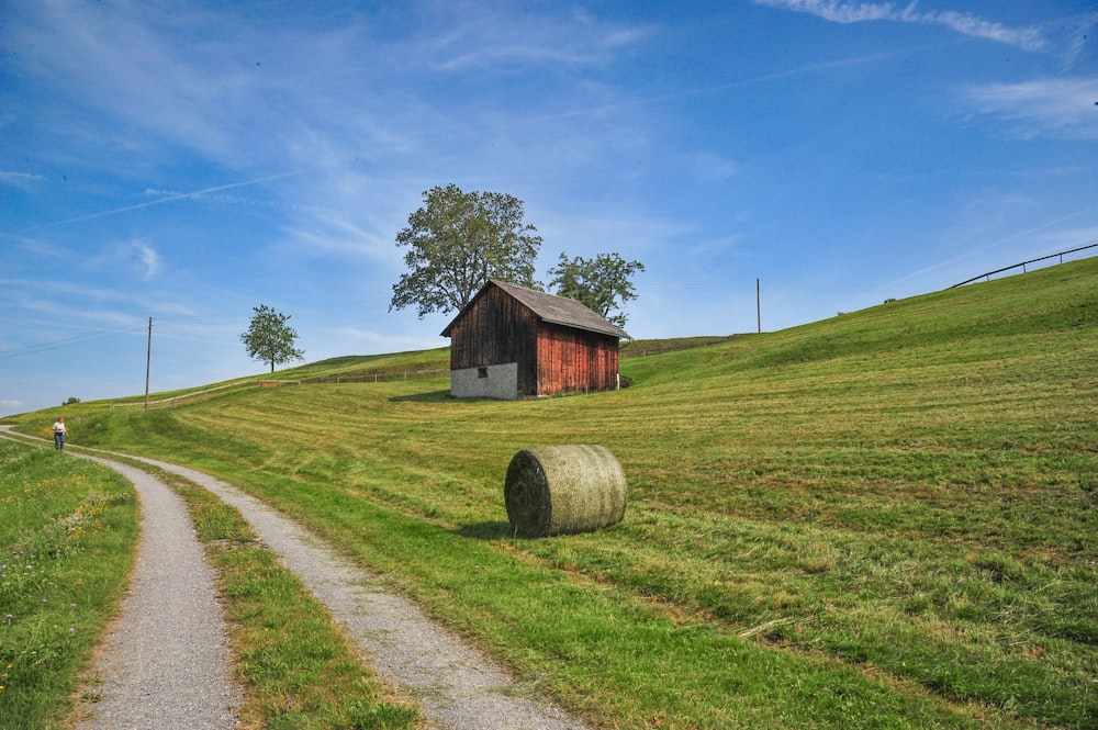 hay roll on the field with cabin at distance