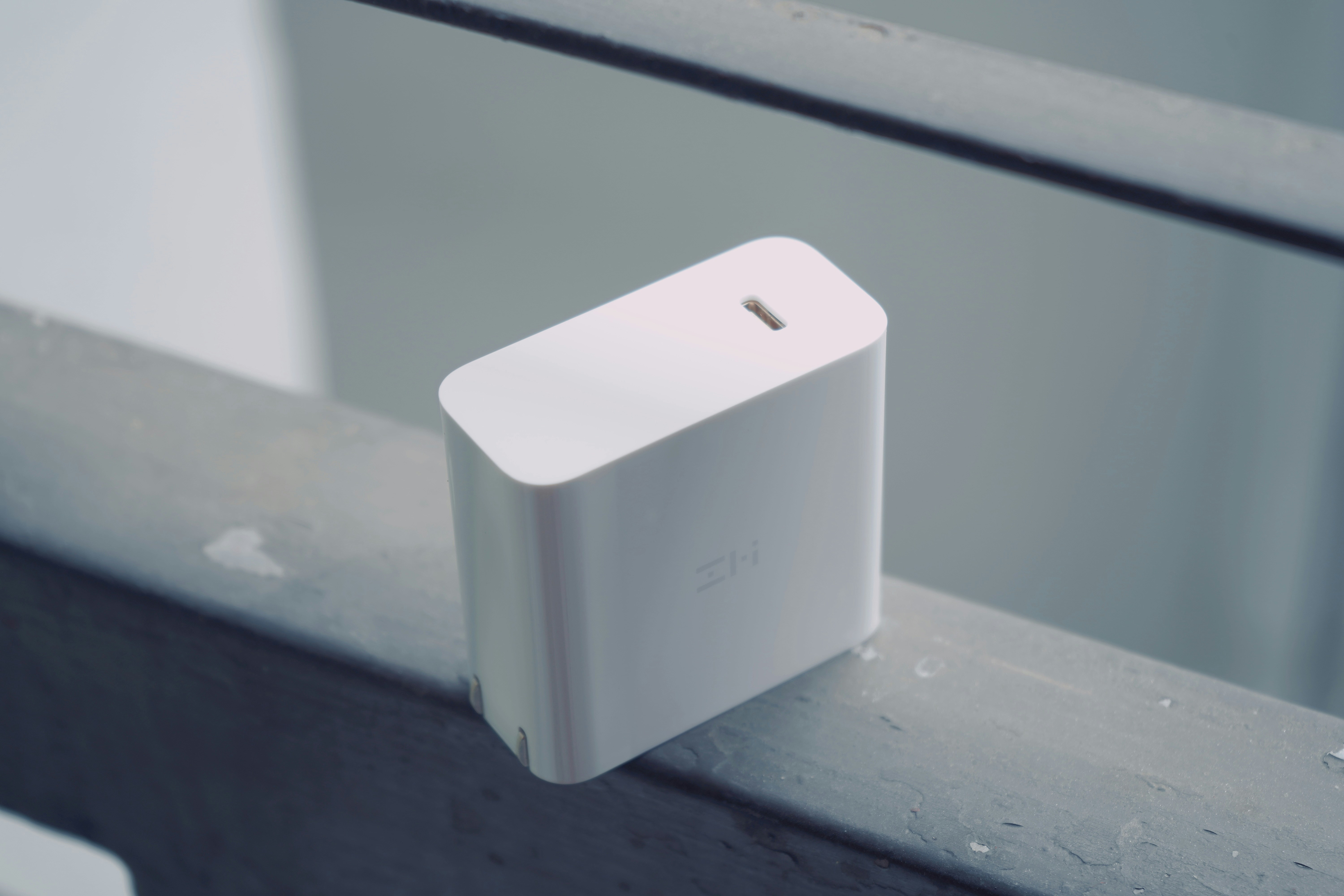 White USB-C fast charging adapter on desk