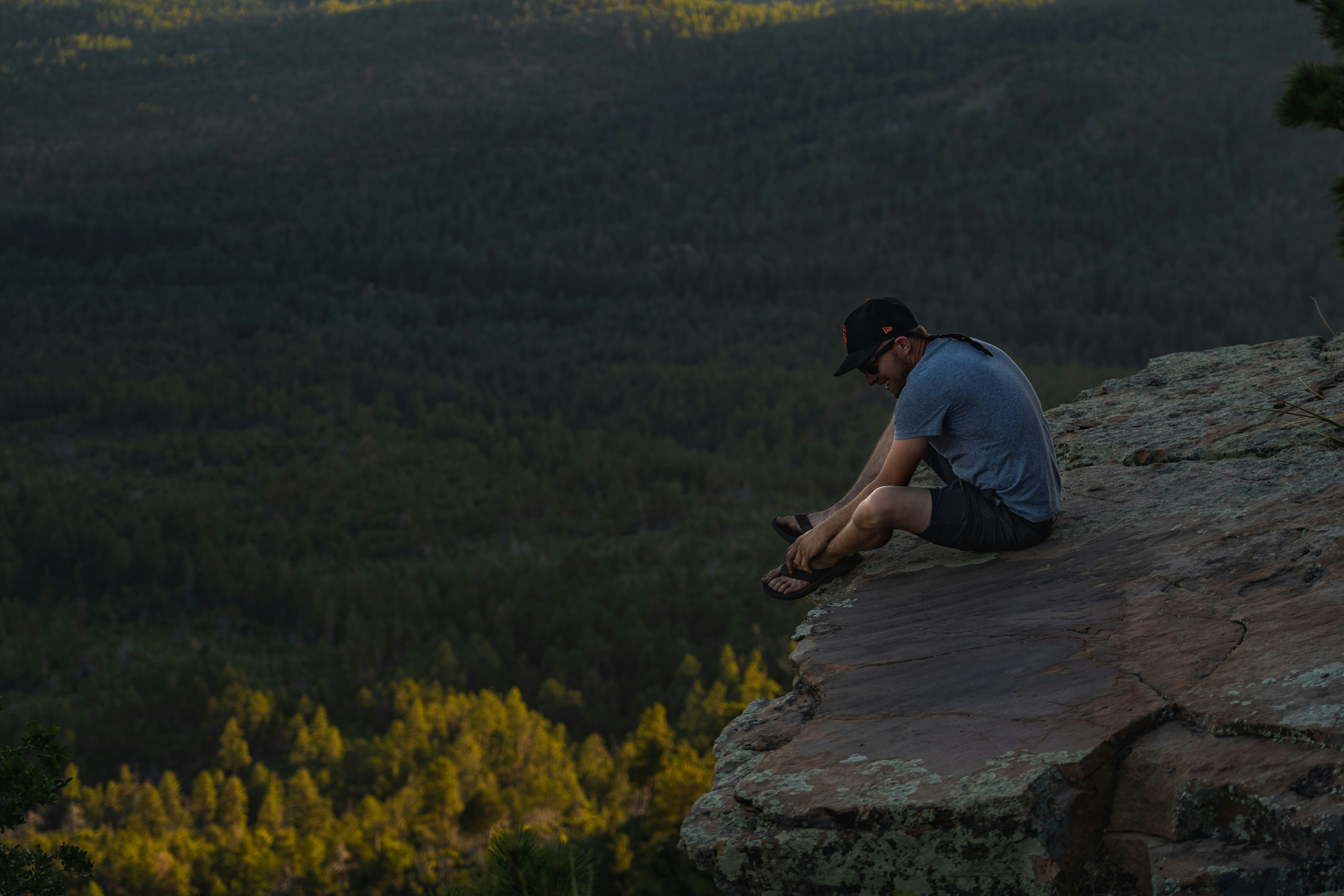 man sitting on ledge