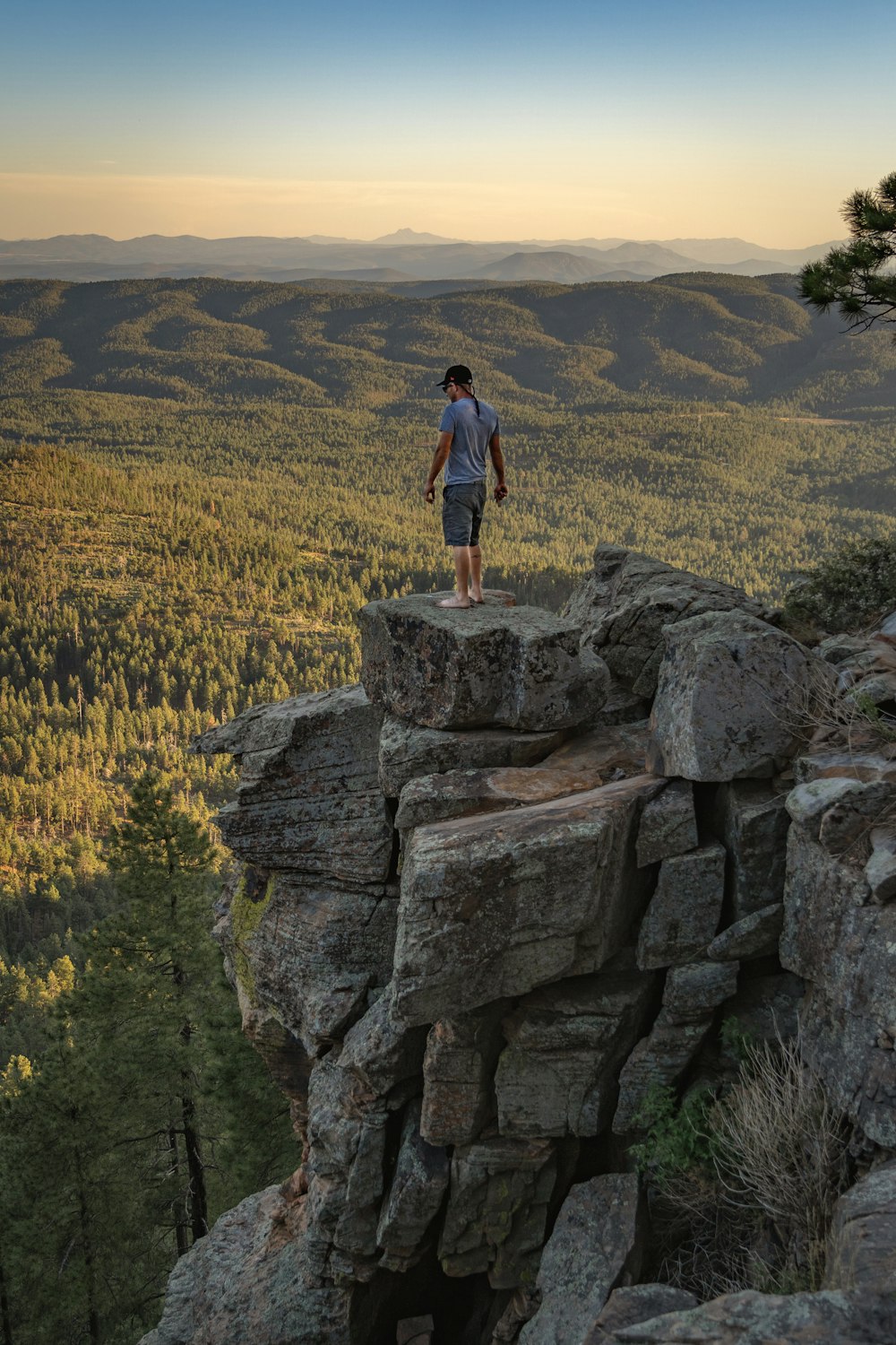 man standing on cliff