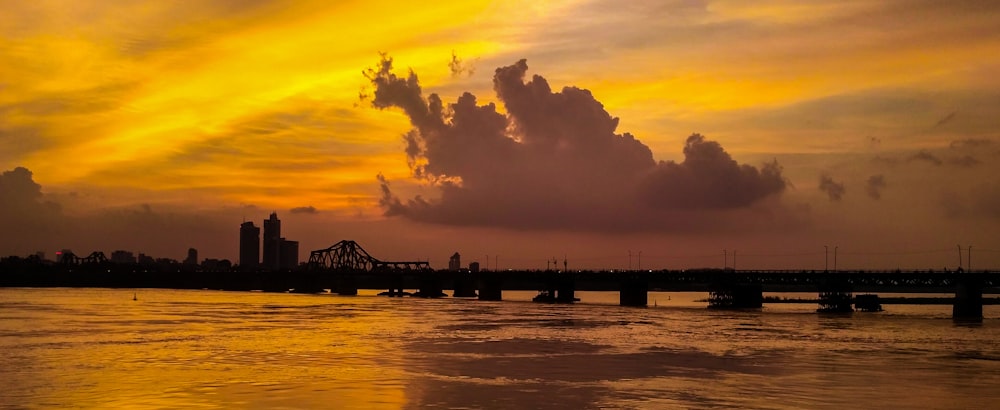 orange skies above bridge