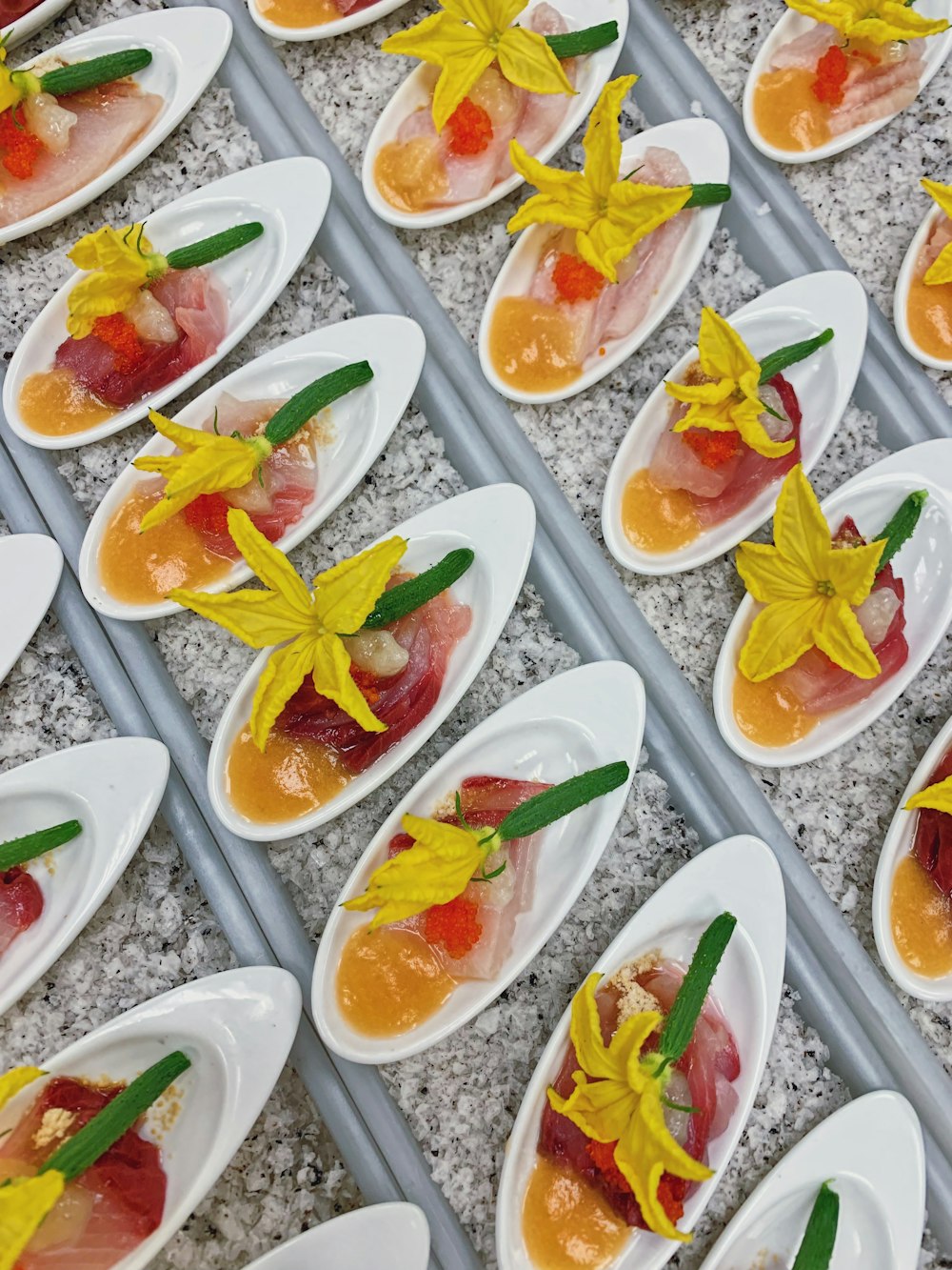 food in oval white ceramic bowl with squash flowers