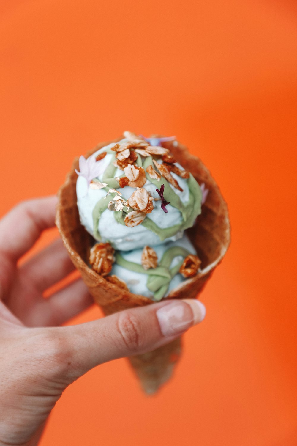 vanilla ice cream with peanuts in ice cream cone