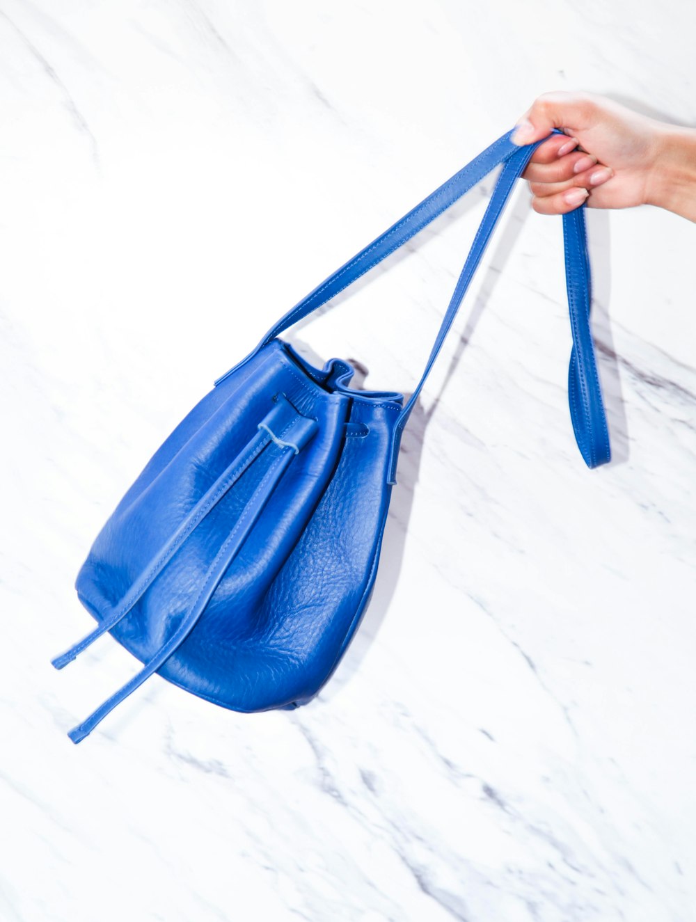 blue leather bucket bag