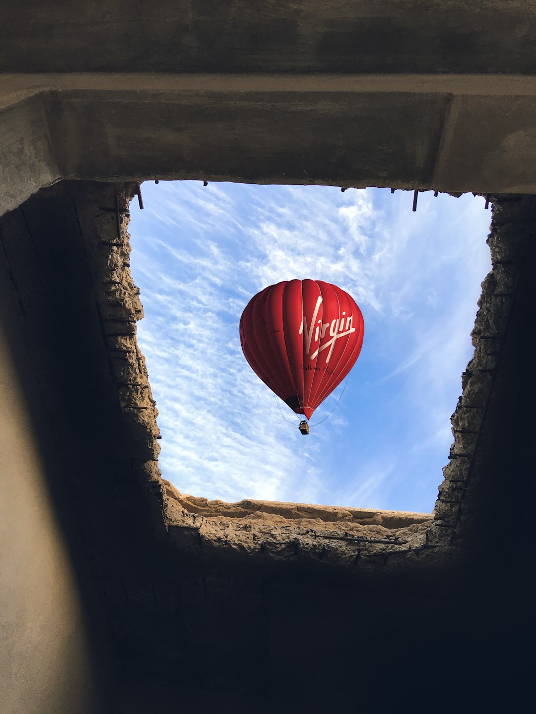 tunnel view of red hot air balloon