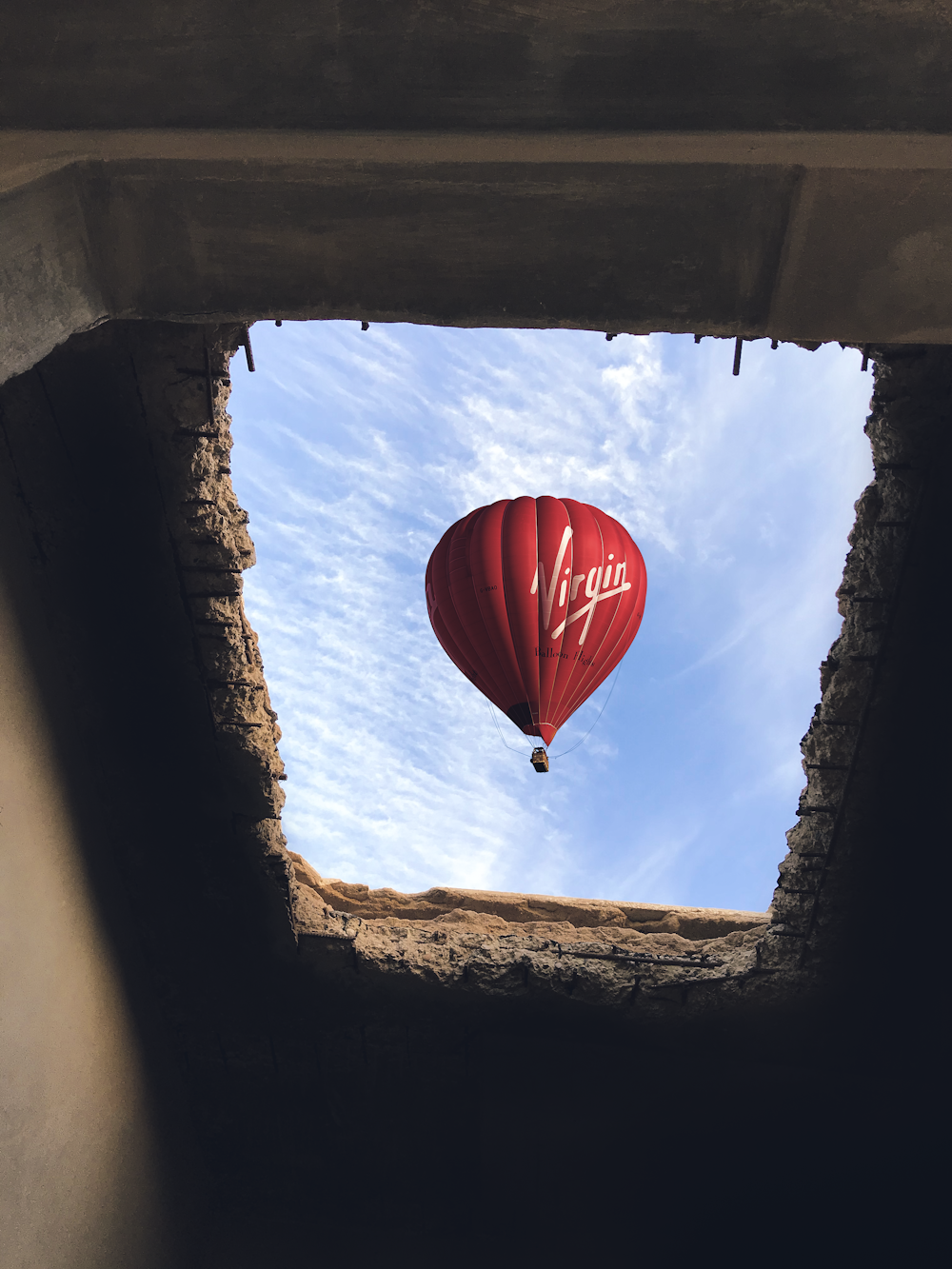 tunnel view of red hot air balloon