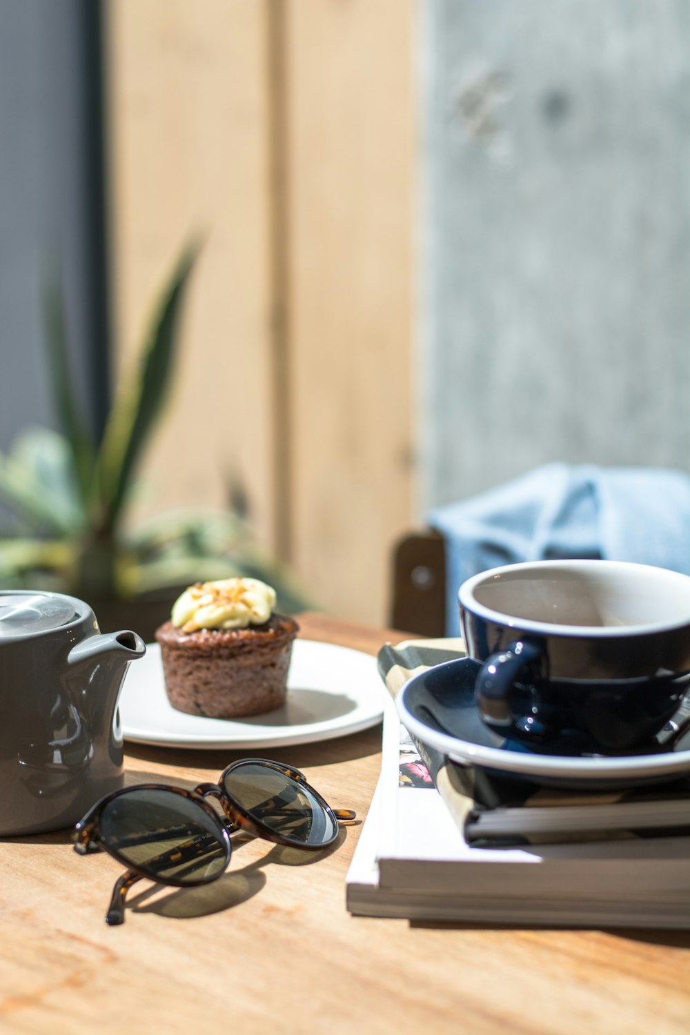 black sunglasses beside books