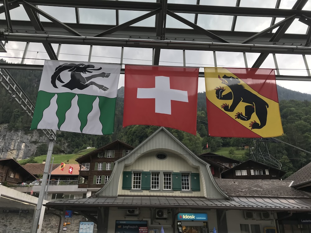 three assorted-color flags
