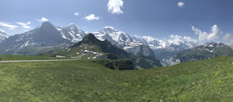 A panoramic view of the Swiss Alps with clear blue skies