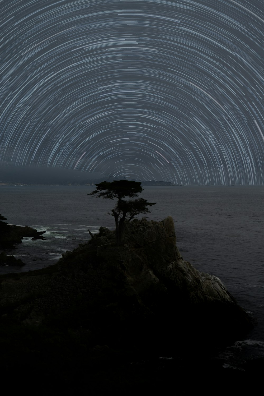 time lapsed photography of stars over the sea