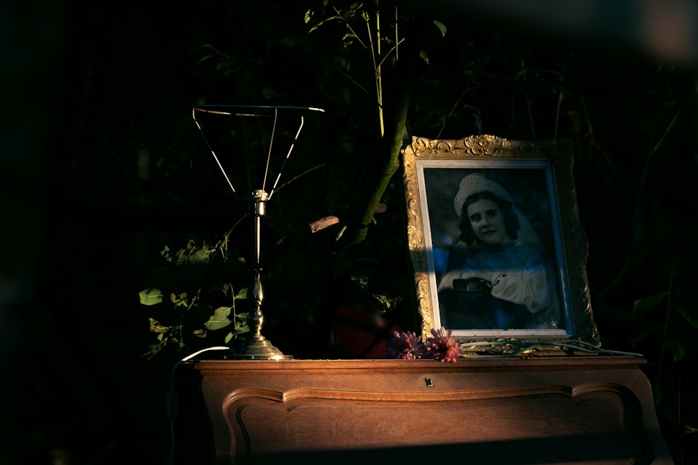 photo of woman in frame on table