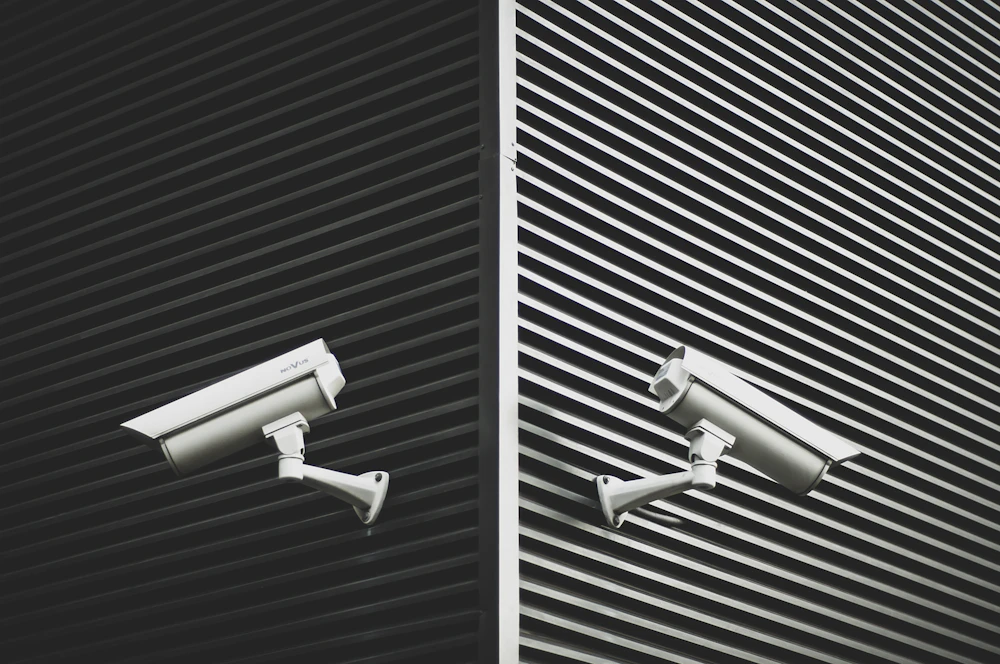 Two CCTV security cameras used for continuous property monitoring