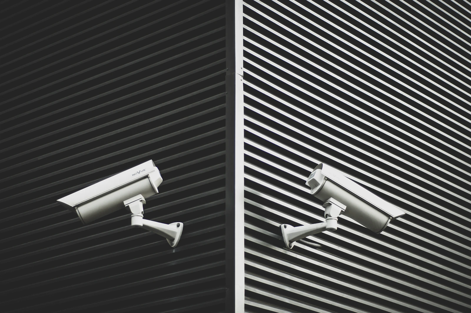 Two grey CCTV cameras