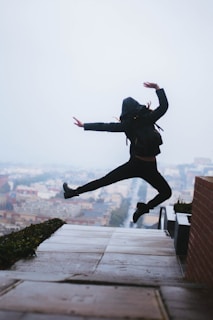 An exciting action game scene showing a character jumping over obstacles in a lively cityscape.