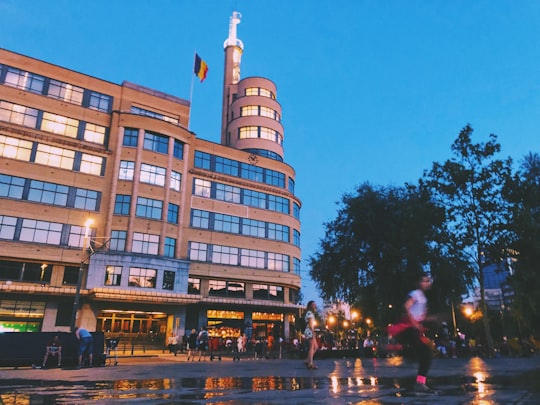 people walking near brown building in Place Flagey Belgium