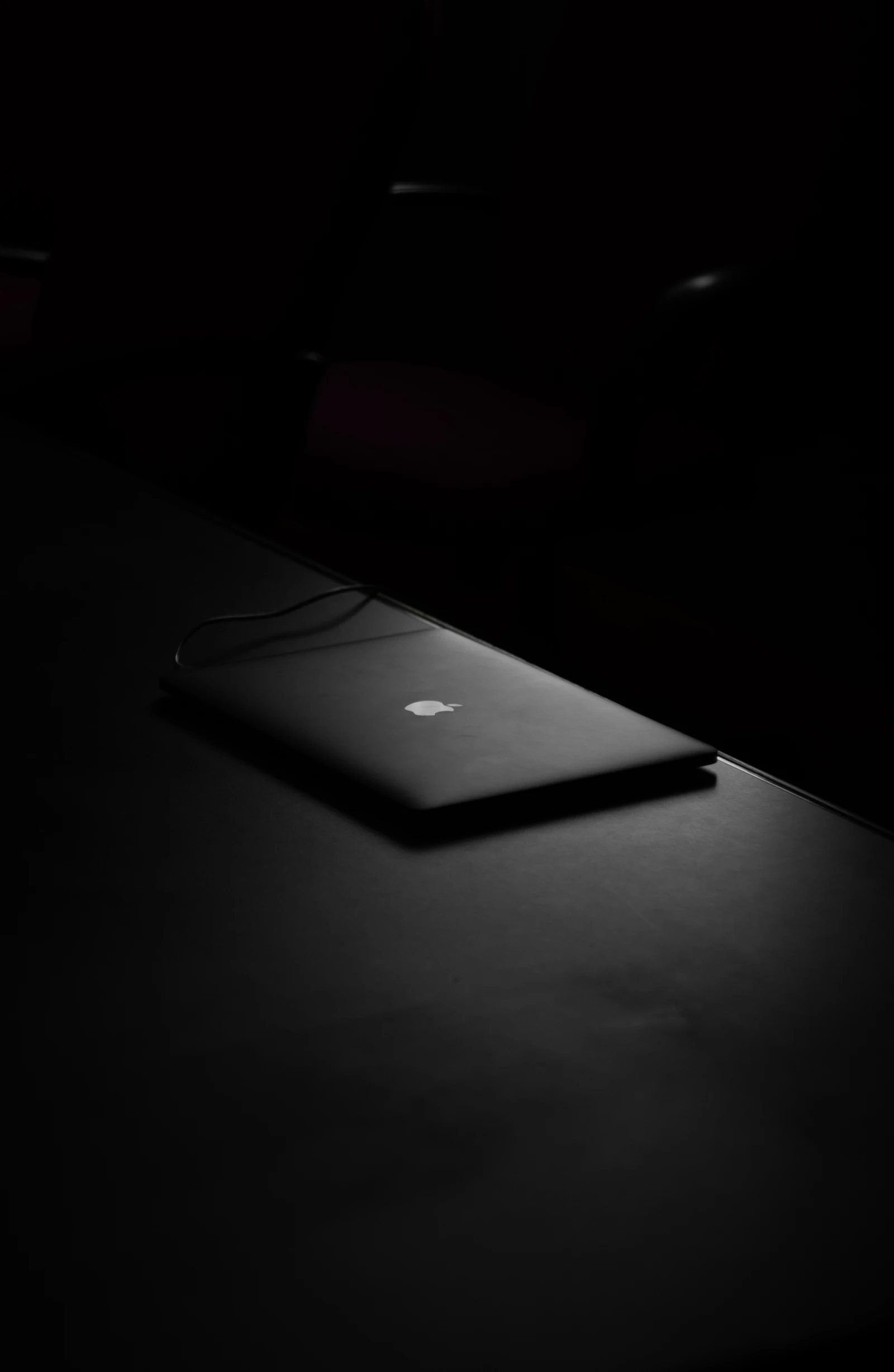 Website design on laptop in dark room