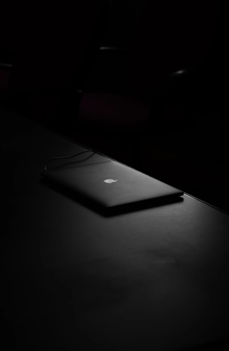 Website design on laptop in dark room