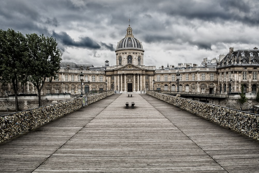 beige concrete building under cloudy sky