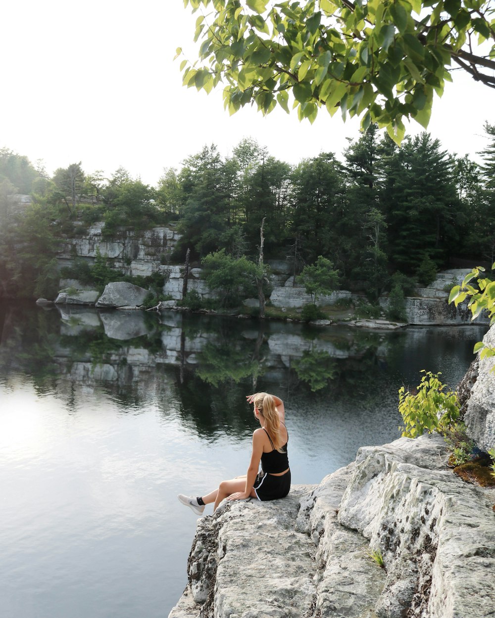 woman sitting on stone