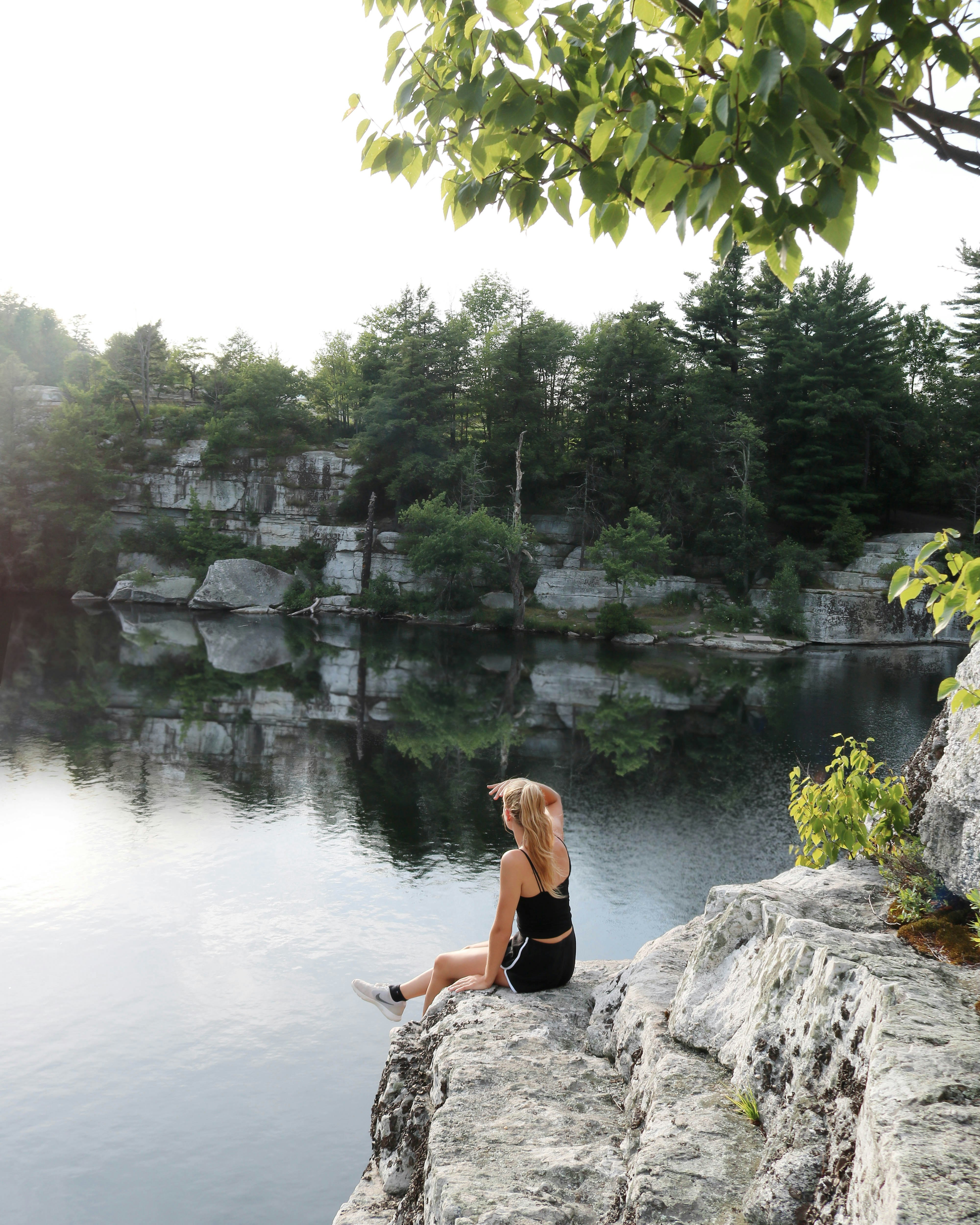 woman sitting on stone