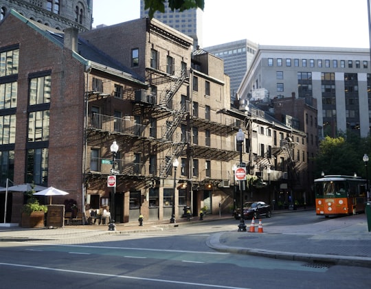 black sedan parking near brown high-rise building in Boston United States