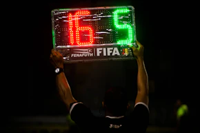 man wearing black polo shirt holding LED signage