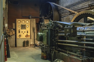 black electronic machine beside wall