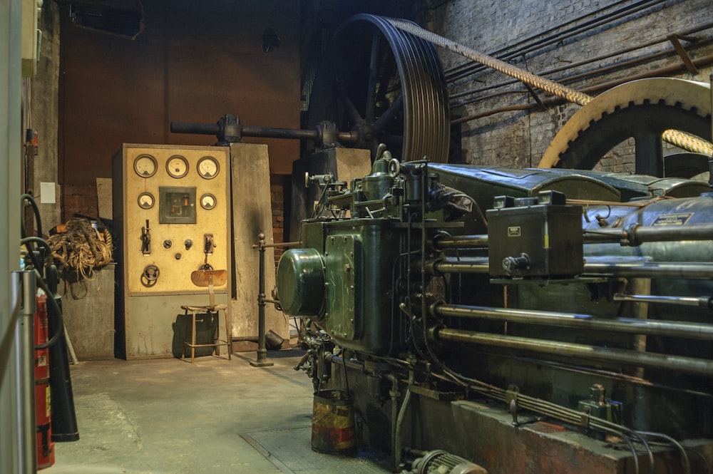 black electronic machine beside wall