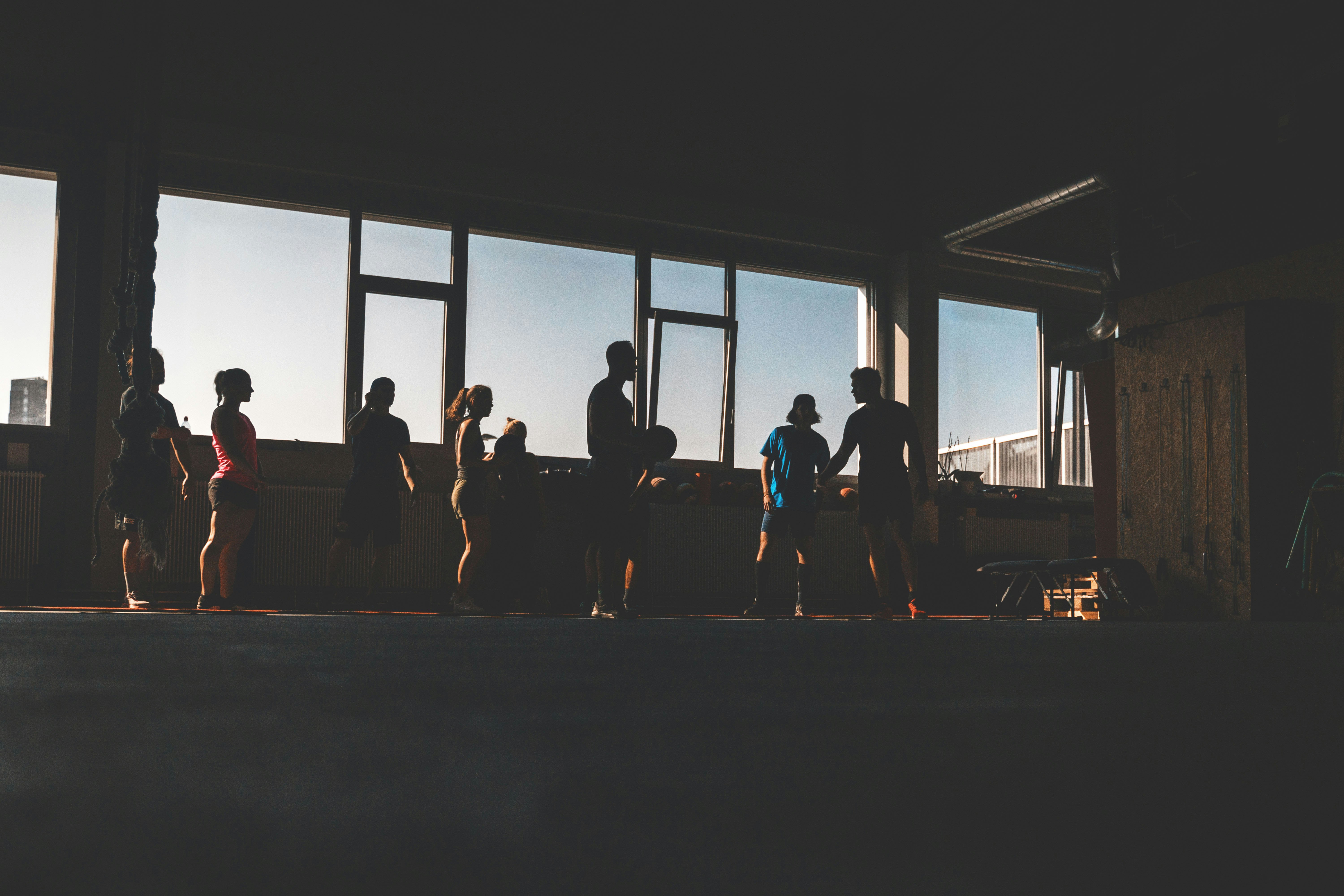 silhouette of people near window