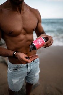 man pouring skin bottle on his hand