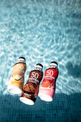 three assorted-color bottles