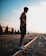 man standing on railings