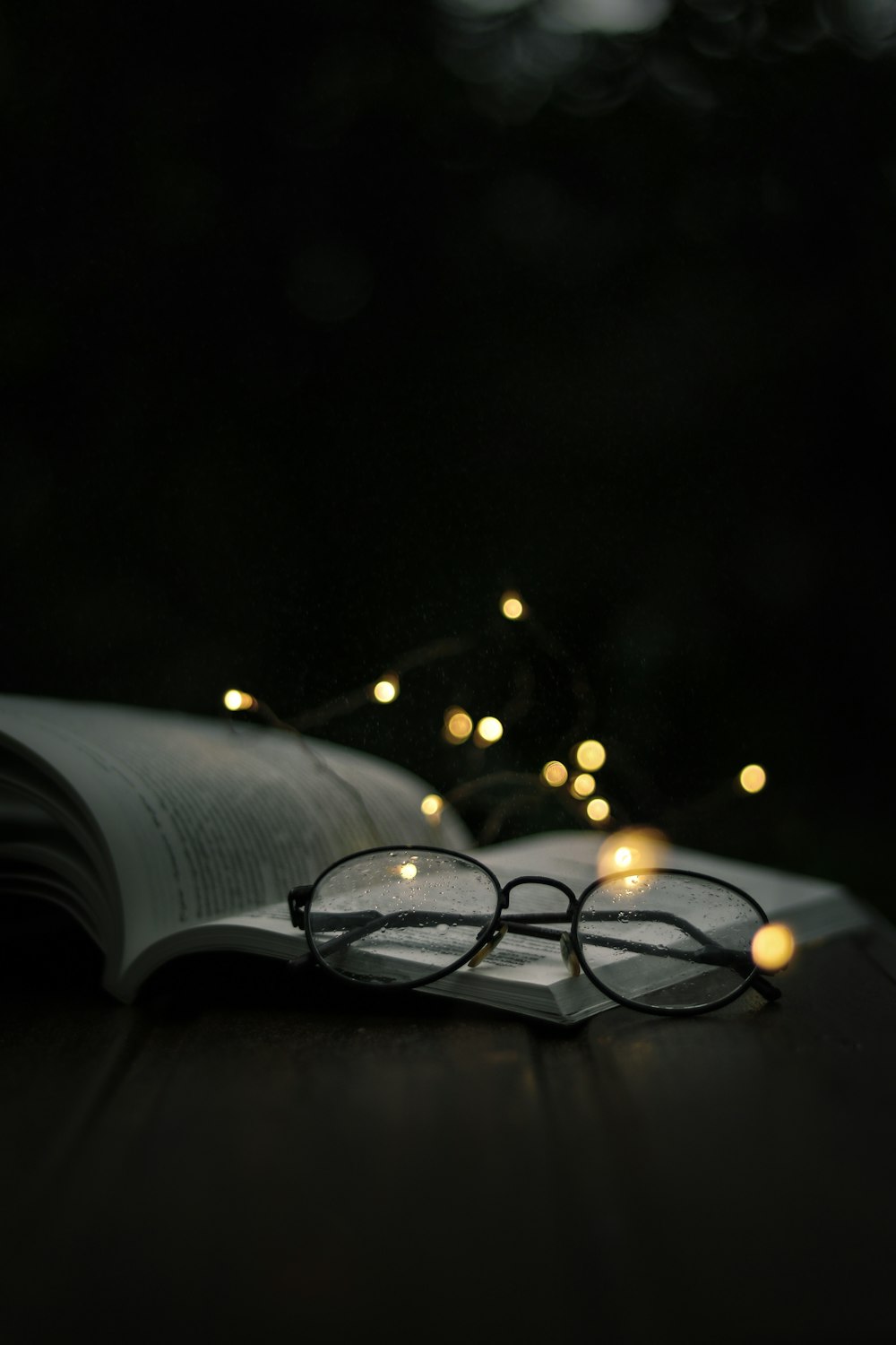 eyeglasses on open book