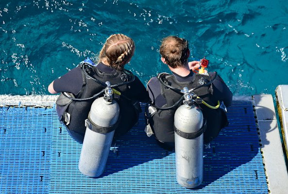 Person sitting in front of body of water — Great Barrier Reef & Cairns, Australia