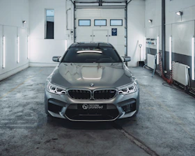 grey BMW car inside building