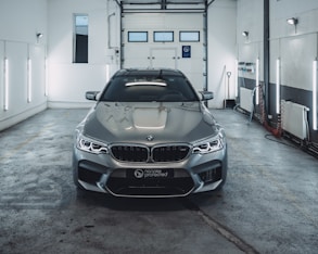 grey BMW car inside building
