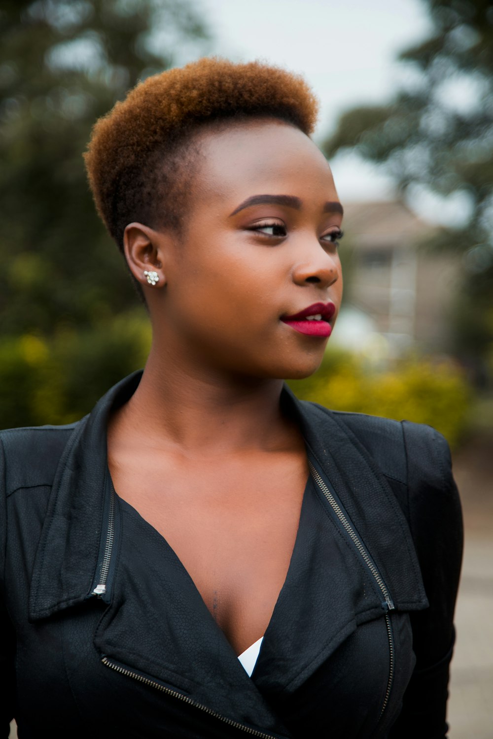 short-haired woman in black blazer