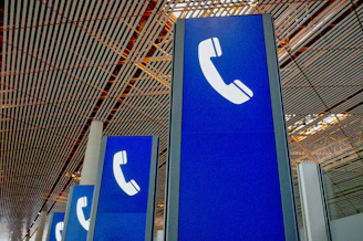 a group of blue signs sitting inside of a building