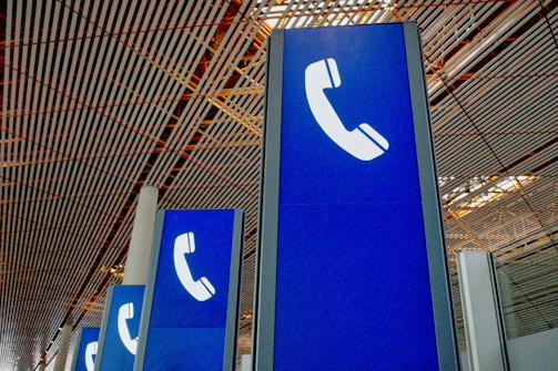 a group of blue signs sitting inside of a building
