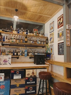 A cozy local beverage store interior with shelves stocked full of drinks.